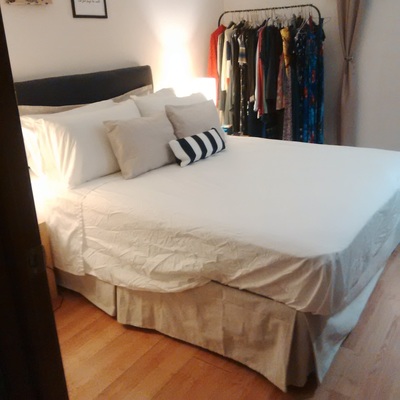 Budget bedroom makeover - after with DIY bedskirt